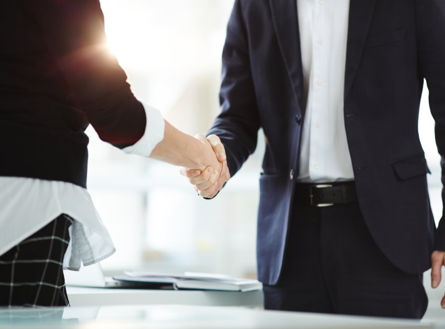 Handshake of successful business partners after negotiation and signing new contract Image about listing SG Partnership and business trusts