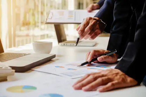 professionals on table consulting about Listing SG