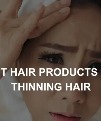 Woman looking at mirror and checking her thinning hair