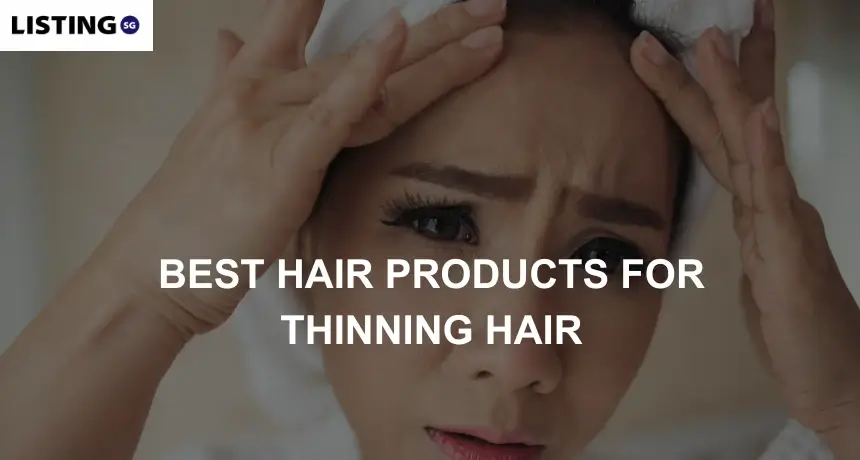 Woman looking at mirror and checking her thinning hair
